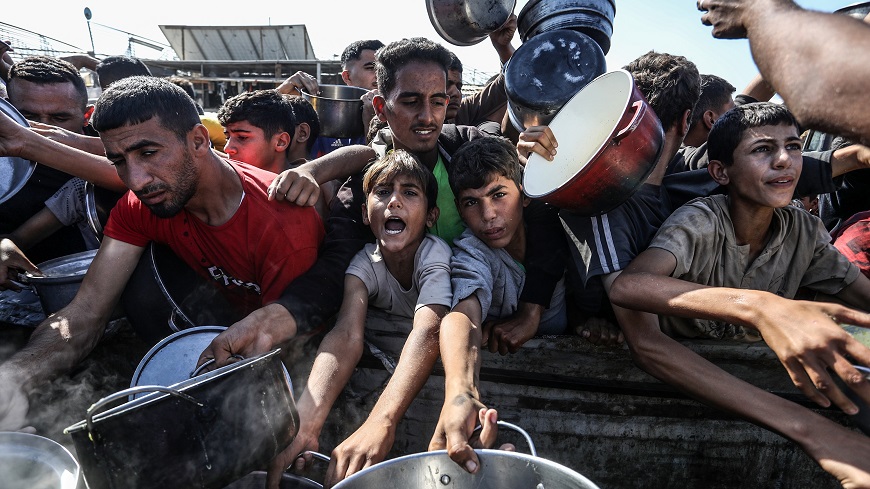Displaced,Palestinians,Line,Up,To,Receive,Meals,From,The,Rafah